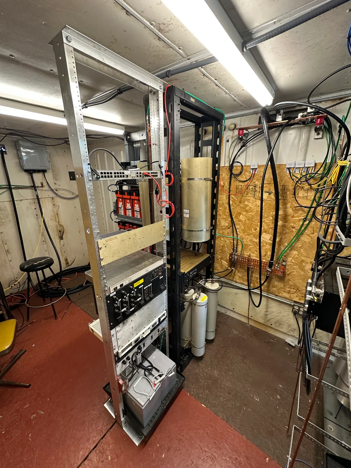 P25 repeater equipment rack with RF hardware and cabling in the equipment room