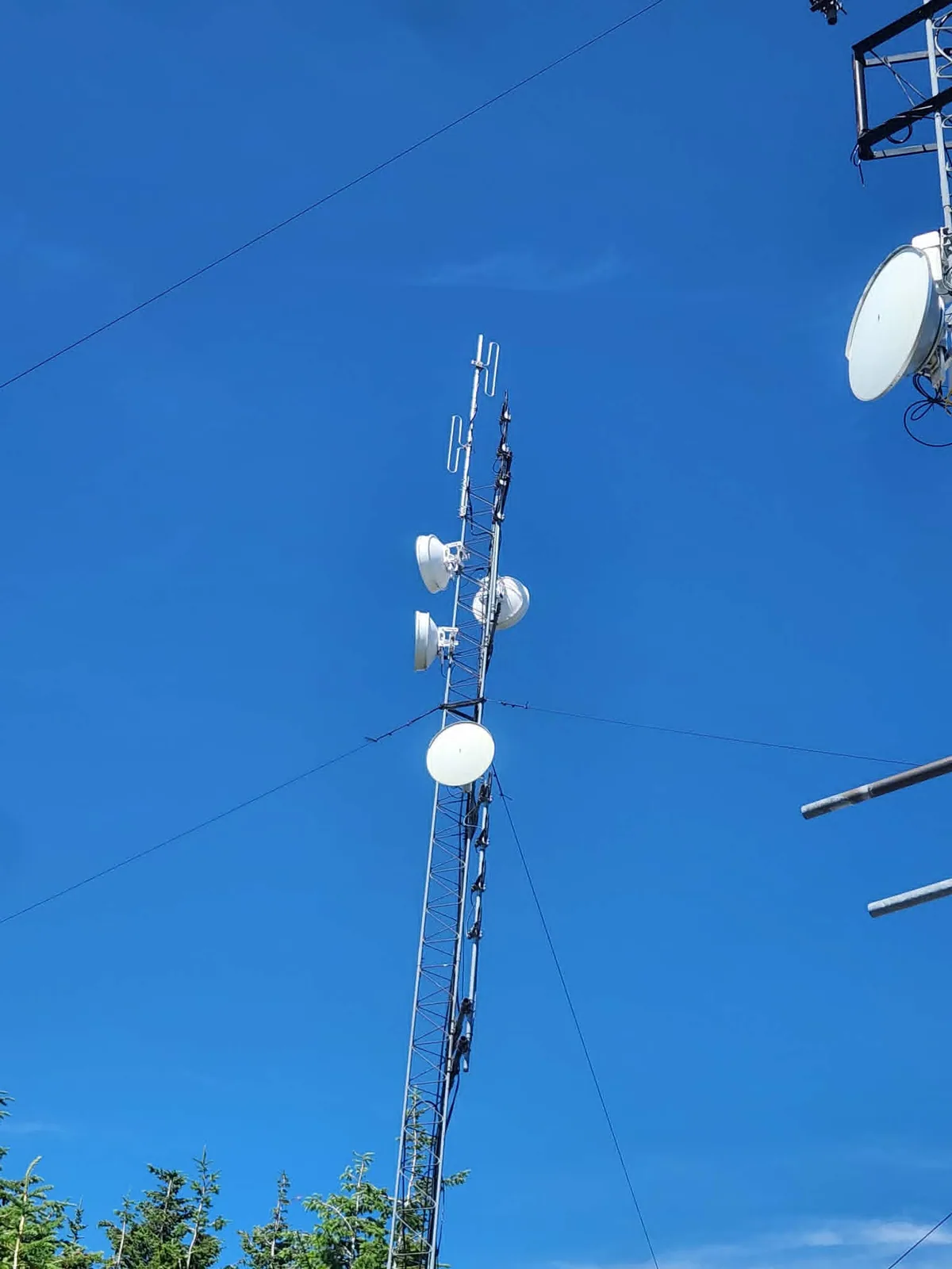Repeater antenna mounted near the top of the tower
